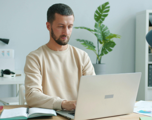 a young man with a laptop