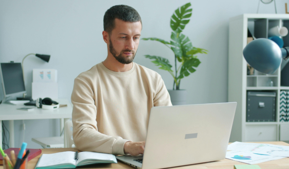 a young man with a laptop